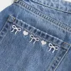 Curvy Low-Rise Embroidered Bow Denim Mini Skort