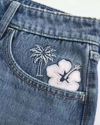 Low-Rise Embroidered Denim Mini Skort