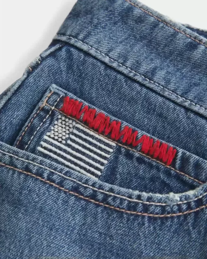 Low-Rise Medium Wash Flag Embroidered Denim Mini Skort