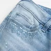 Ultra Low-Rise Distressed Light Wash Sequin Flare Jeans